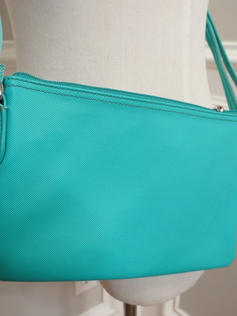 Lacoste Teal crossover bag PVC w/leather trimming